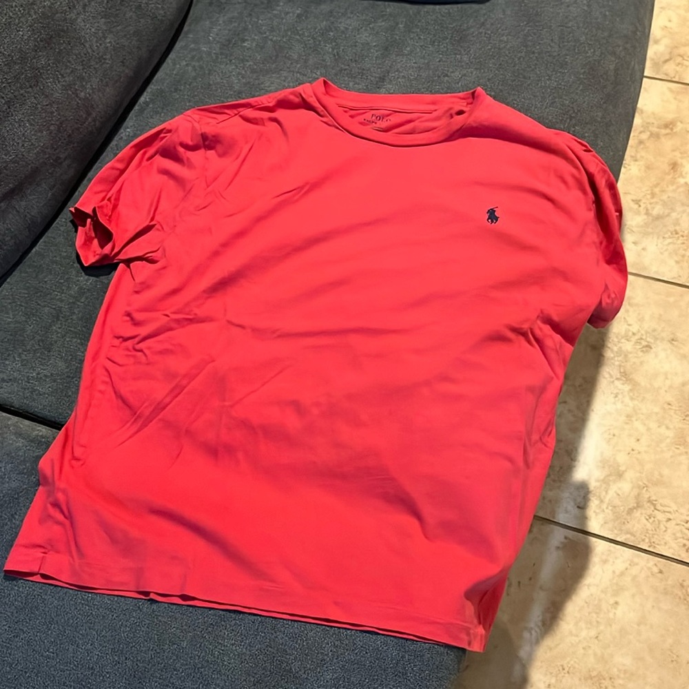 Mauve colored polo tee.